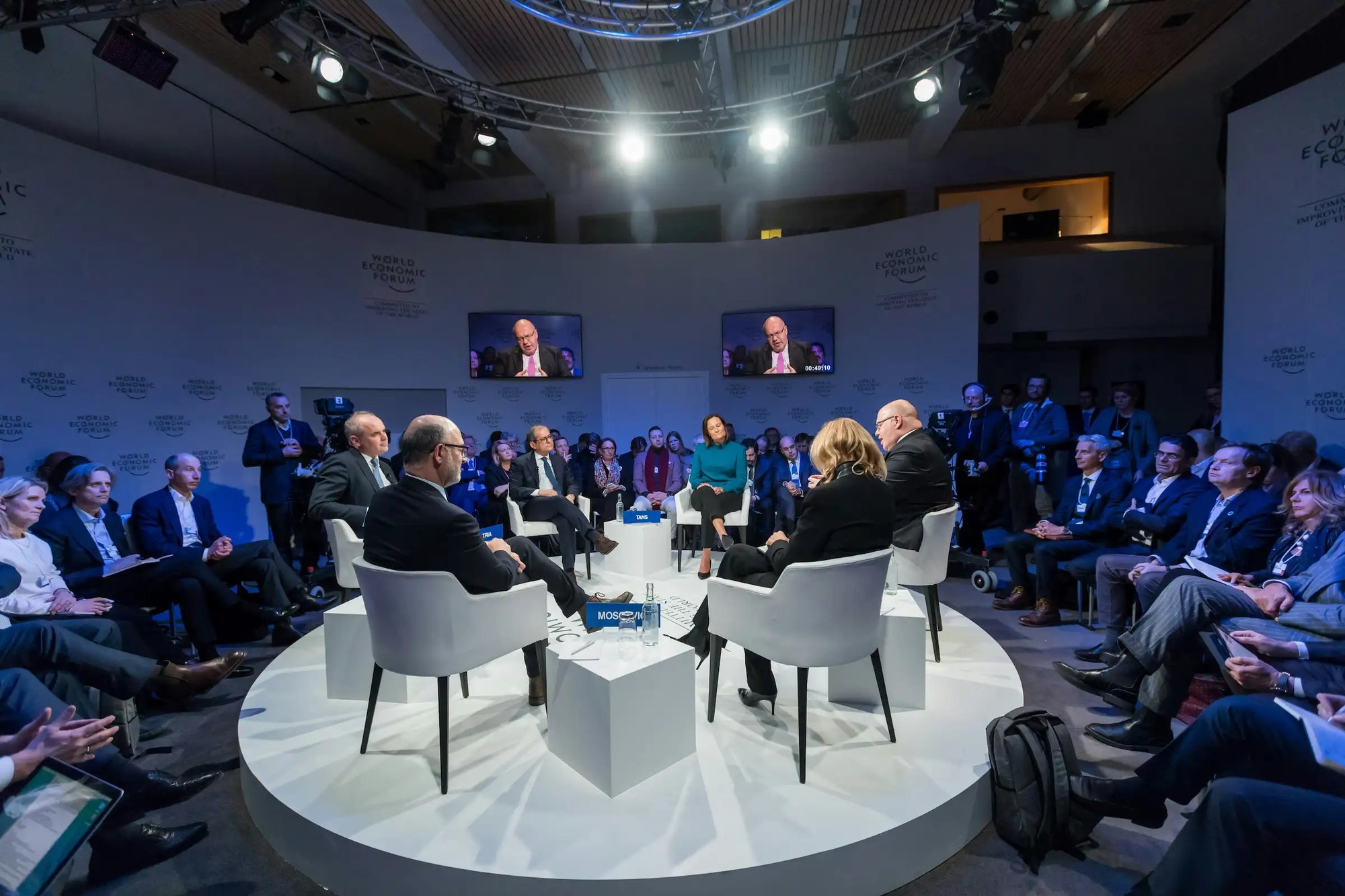 speakers on a raised round stage