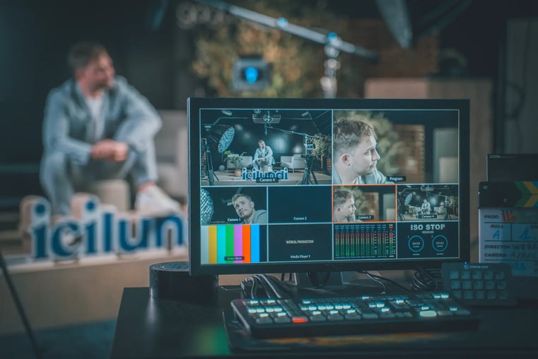 Broadcast monitor showing a multi-camera picture-in-picture switcher view during a live production