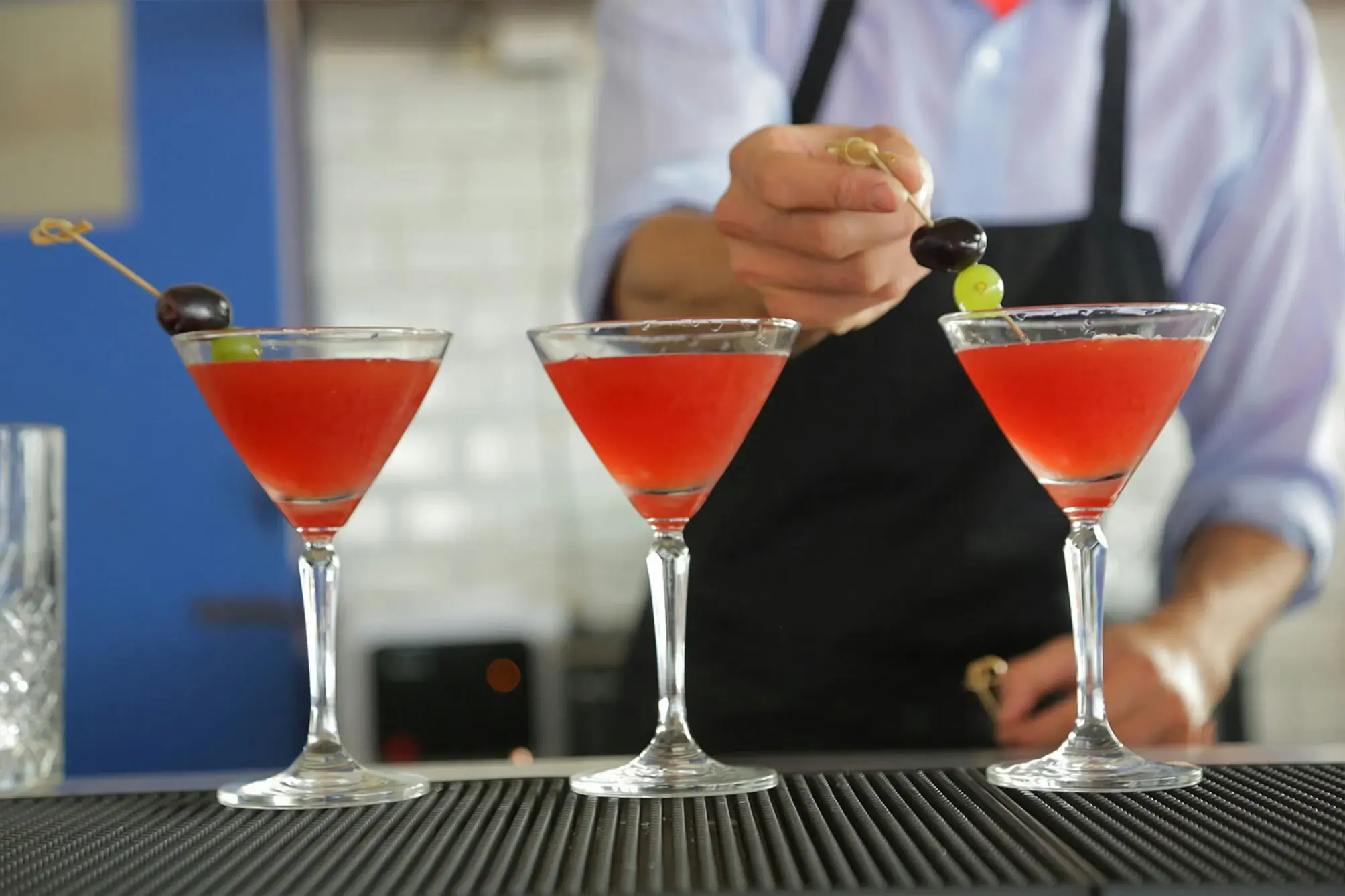 person making martinis